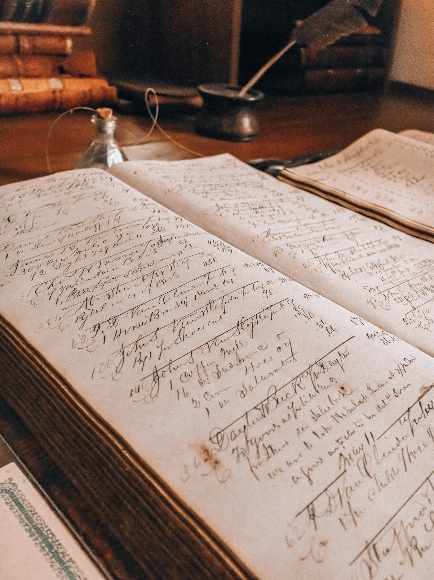 An old handwritten records ledger on a desk